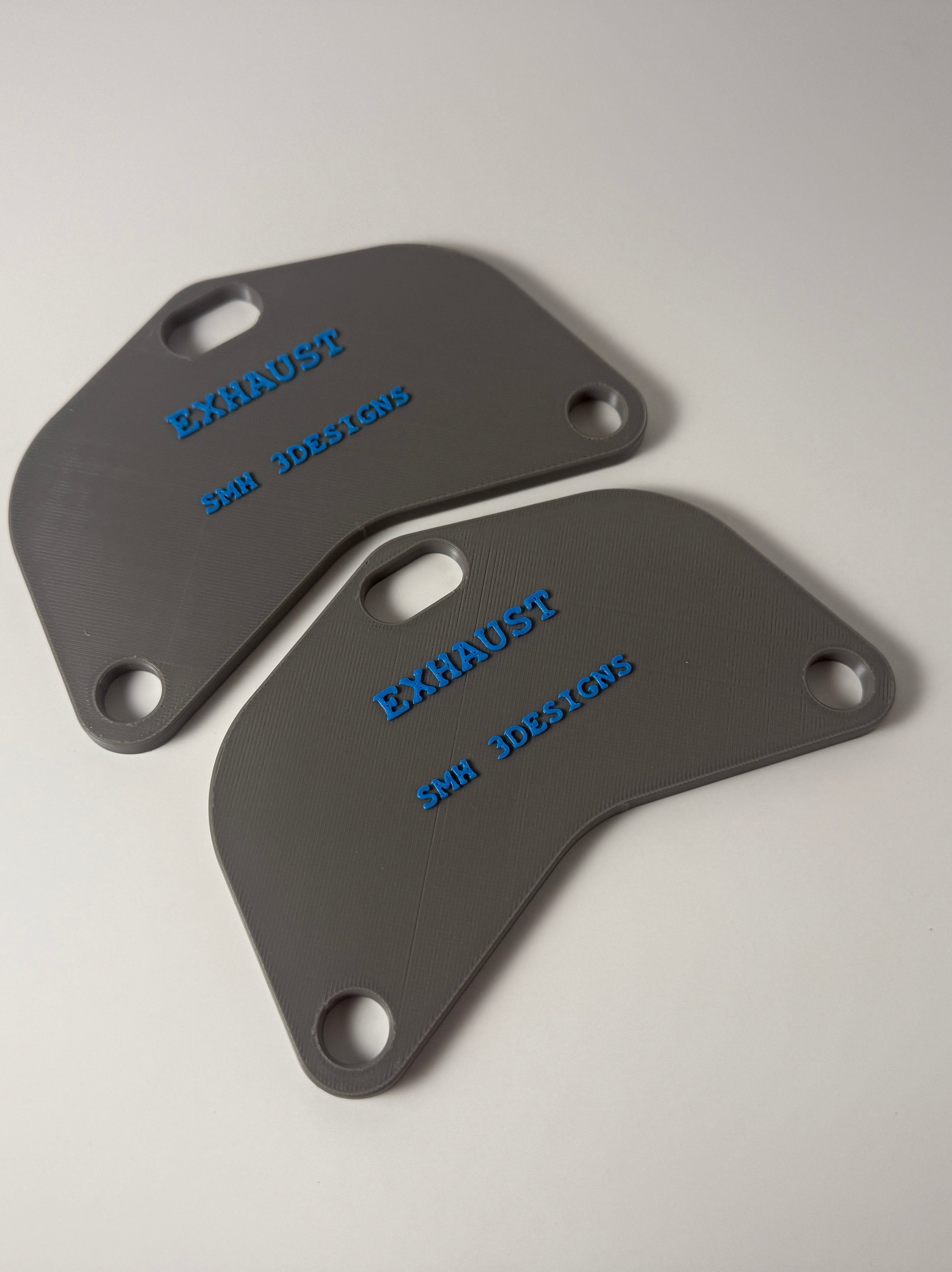 3D Printed Exhaust Port Block-Off Plates for Subaru EJ, FA & FB Engines. Off Color.